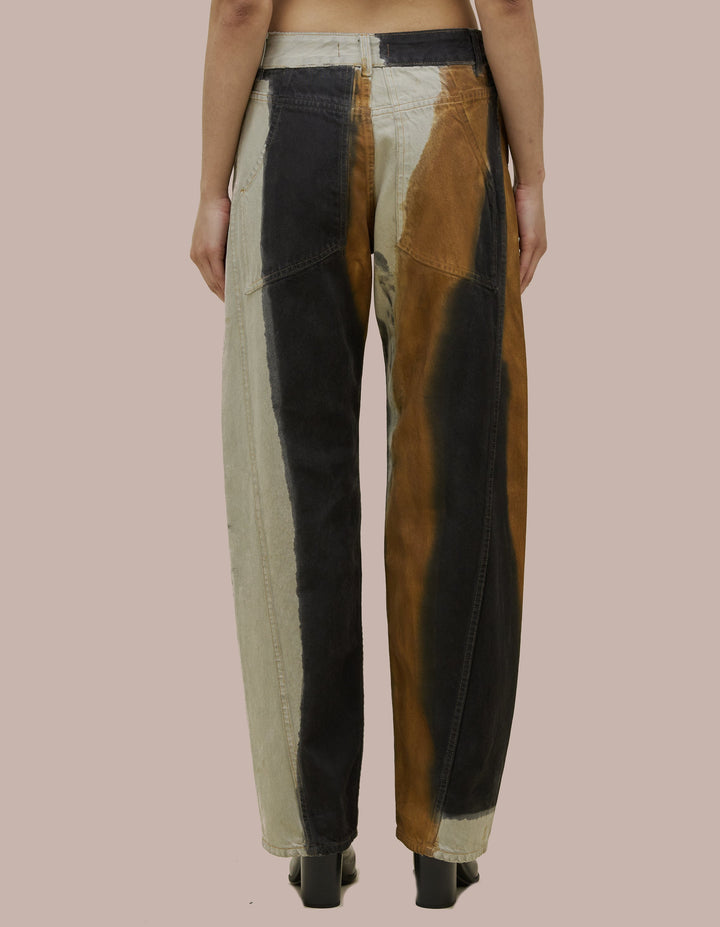 Mid-rise Eckhaus Latta jean in 14oz cotton indigo denim, bleached to a bright white base and hand-painted with graphic rust and black placements. Features a bowed leg with twisted side seams and signature EL back pockets.