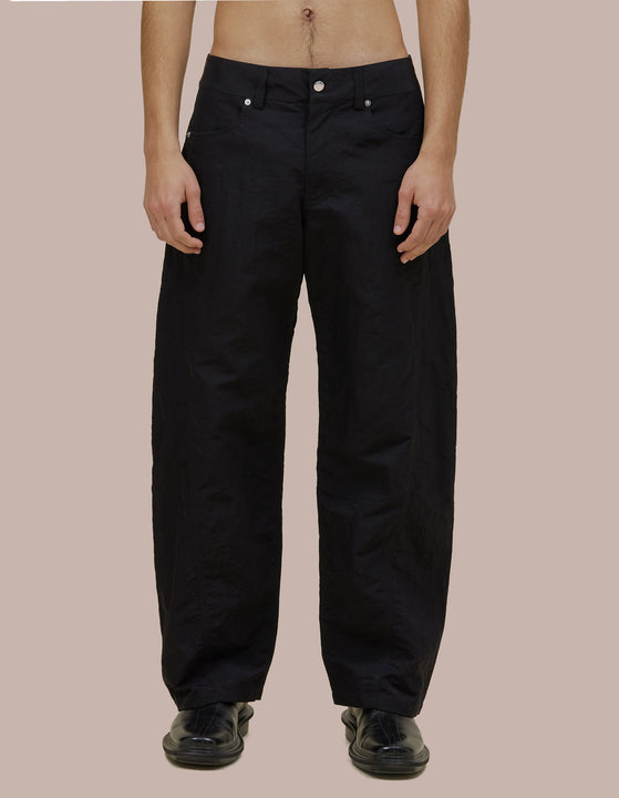 Mid-rise Eckhaus Latta pant in Italian nylon with a bowed leg and twisted side seams for subtle shape. Finished with signature EL back pockets.
