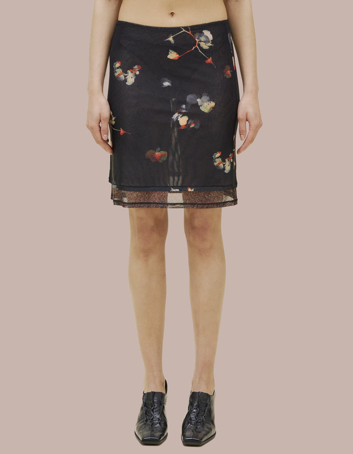 Eckhaus Latta slim fitting slip skirt with picot edge at waistband. Made of double layer digitally printed micromesh. Each layer has a distinct all over print, with the bottom layer peeking out from the hem of the top layer. 