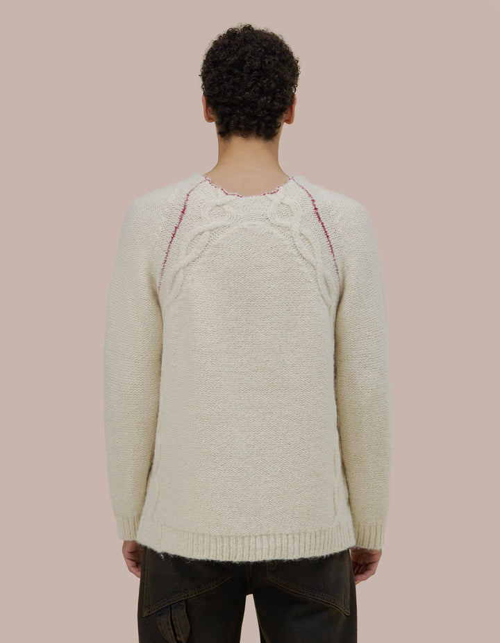 Oversized Eckhaus Latta pullover sweater in a twisted alpaca/wool boucle yarn. Cable details runs all along the body up to funnel neck. Sweater is linked together with a contrast yarn.