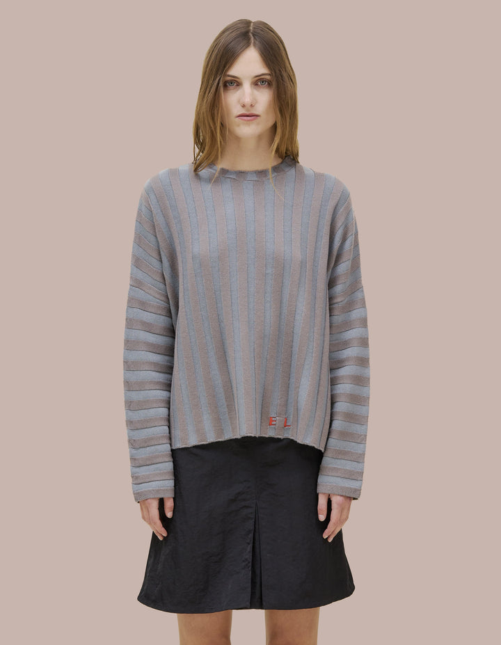 Eckhaus Latta boxy crewneck dolman shaped sweater in 100% merino wool with a contrast striped wide rib. Features our new intarsia knit EL logo in red.