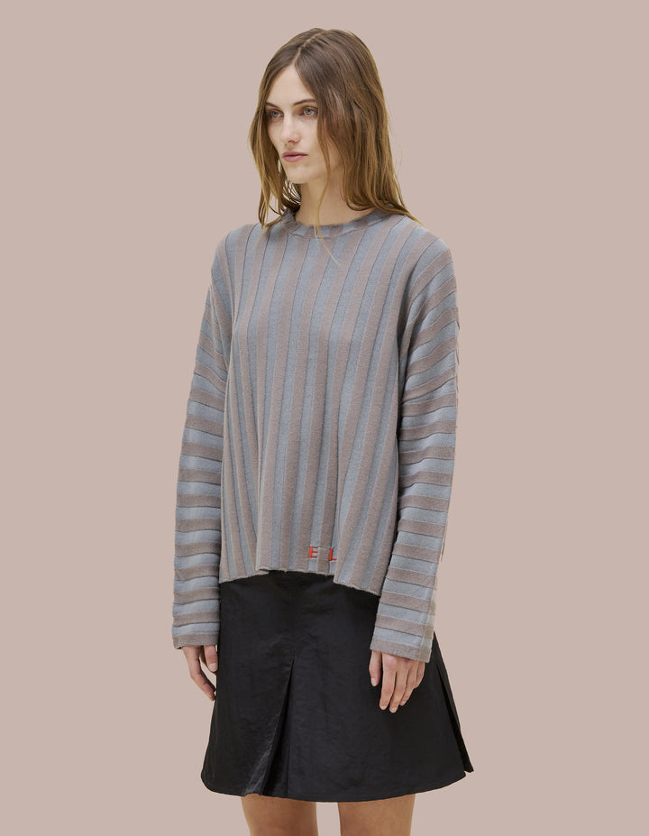 Eckhaus Latta boxy crewneck dolman shaped sweater in 100% merino wool with a contrast striped wide rib. Features our new intarsia knit EL logo in red.