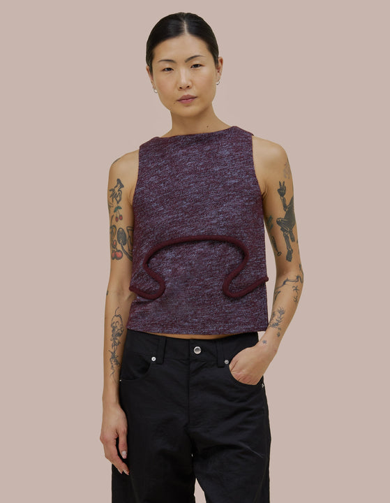 Eckhaus Latta tank that features a boat neck with a boxy fit and bound curvilinear seams creating definition as they move across your body. Made from a boiled wool cotton blend.