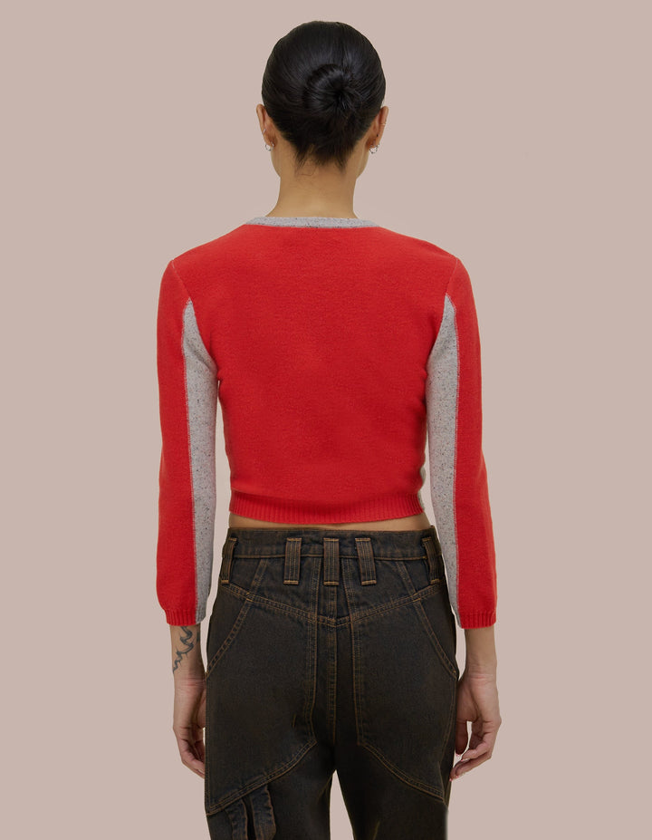 Button front  Eckhaus Latta cardiga with a cropped shrunken fit. Feattured Eckhaus Latta Logo buttons and donegal speckled details throughout the yarn with coloblocking throughout.